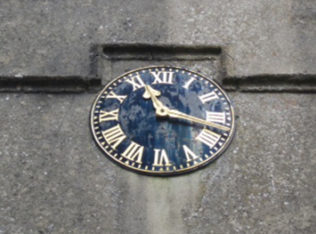 Baydon church clock that is dedicated to the memory of those who fell