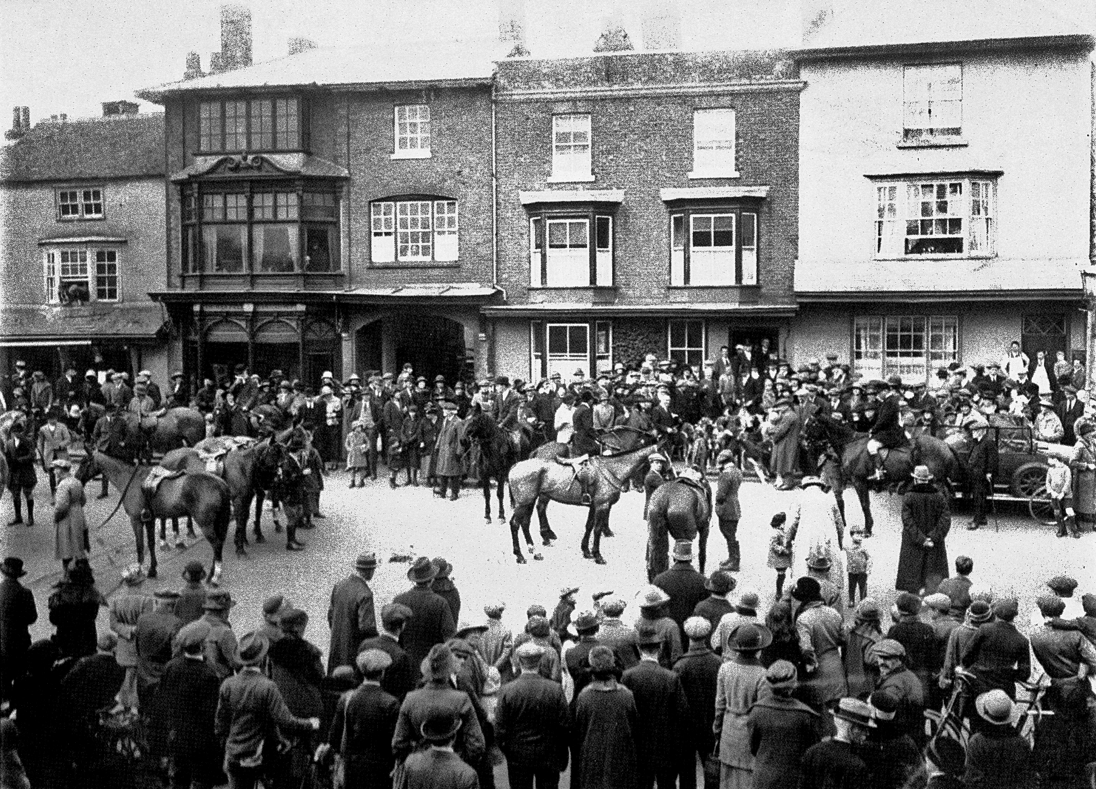 A meet of either the Tedworth or Craven Hunt in the High Street in the 1920s
